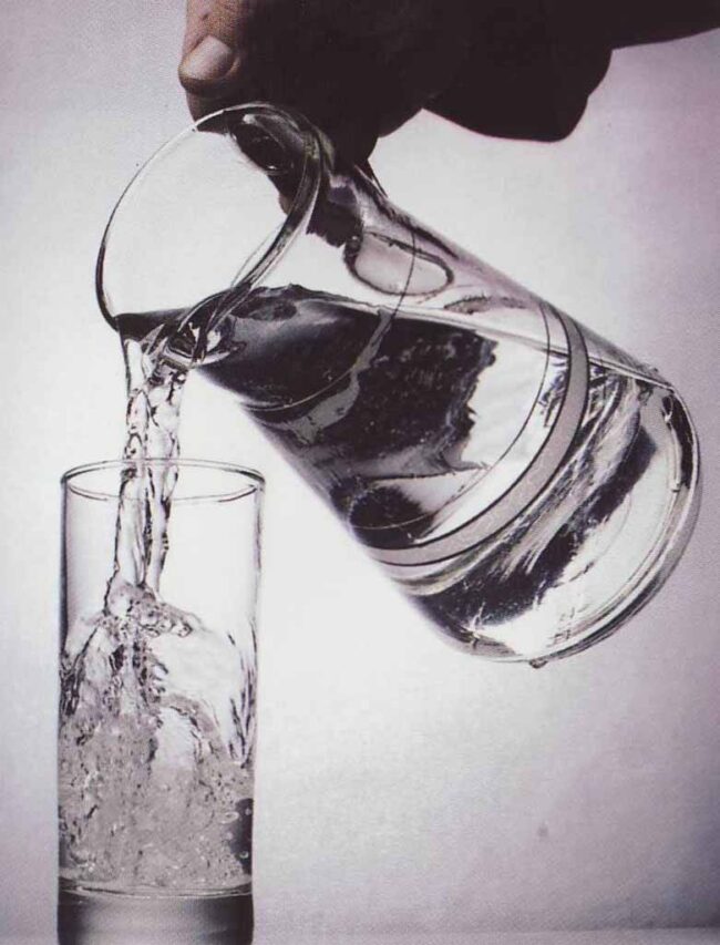 pouring water into glass pouring water into glass