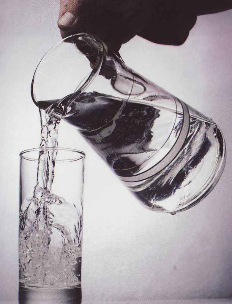 pouring water into glass