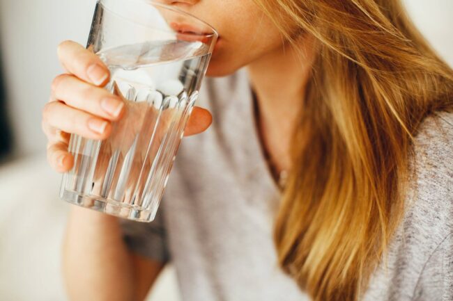woman drinking water woman drinking water