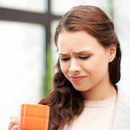 Woman Frowning at Bad Water