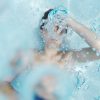 Boy in pool chlorine